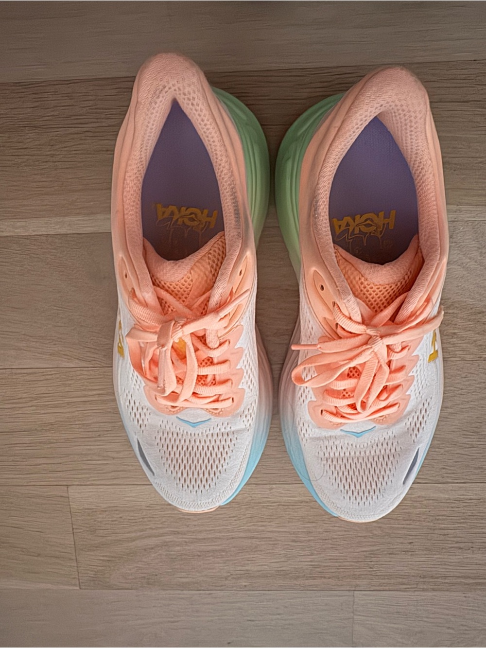 Women's HOKA Bondi 9 running shoes in a Frost/Pale Tangerine colorway